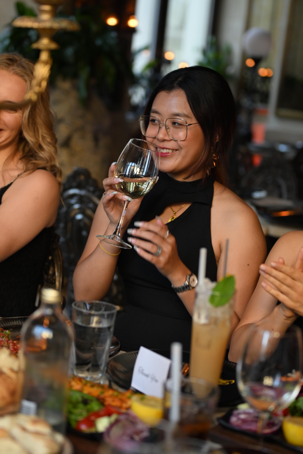 A member sipping wine during the members' dinner