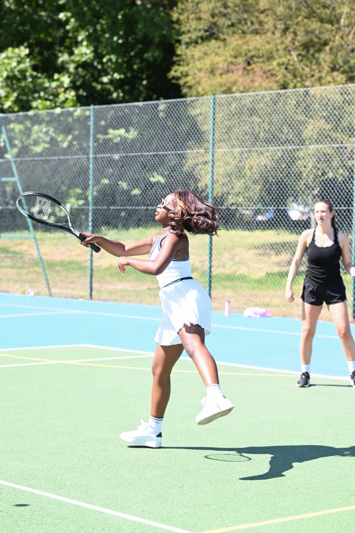 A member following through on a forehand during a rally