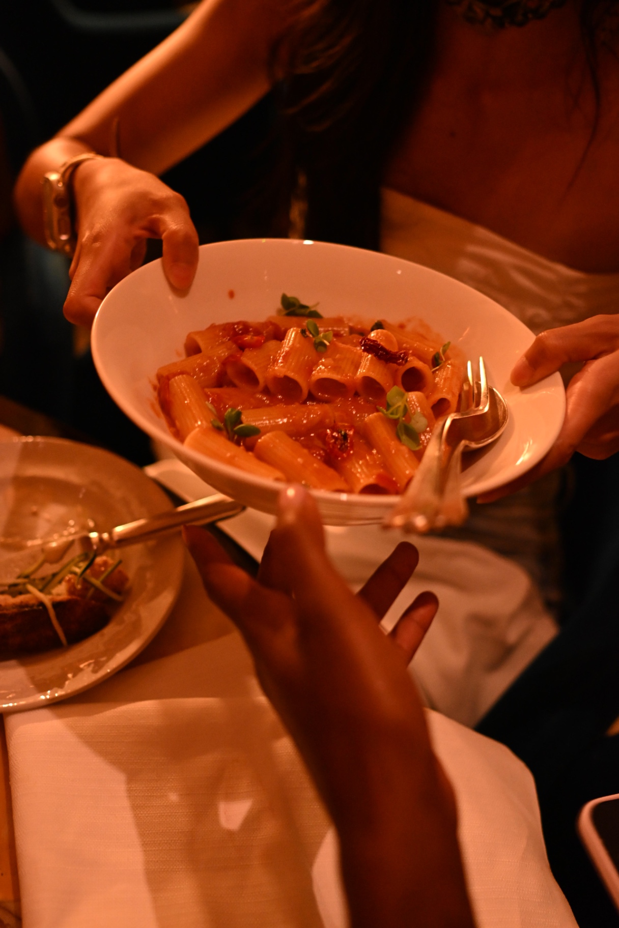 A bowl of rigatoni being shared at the members' dinner