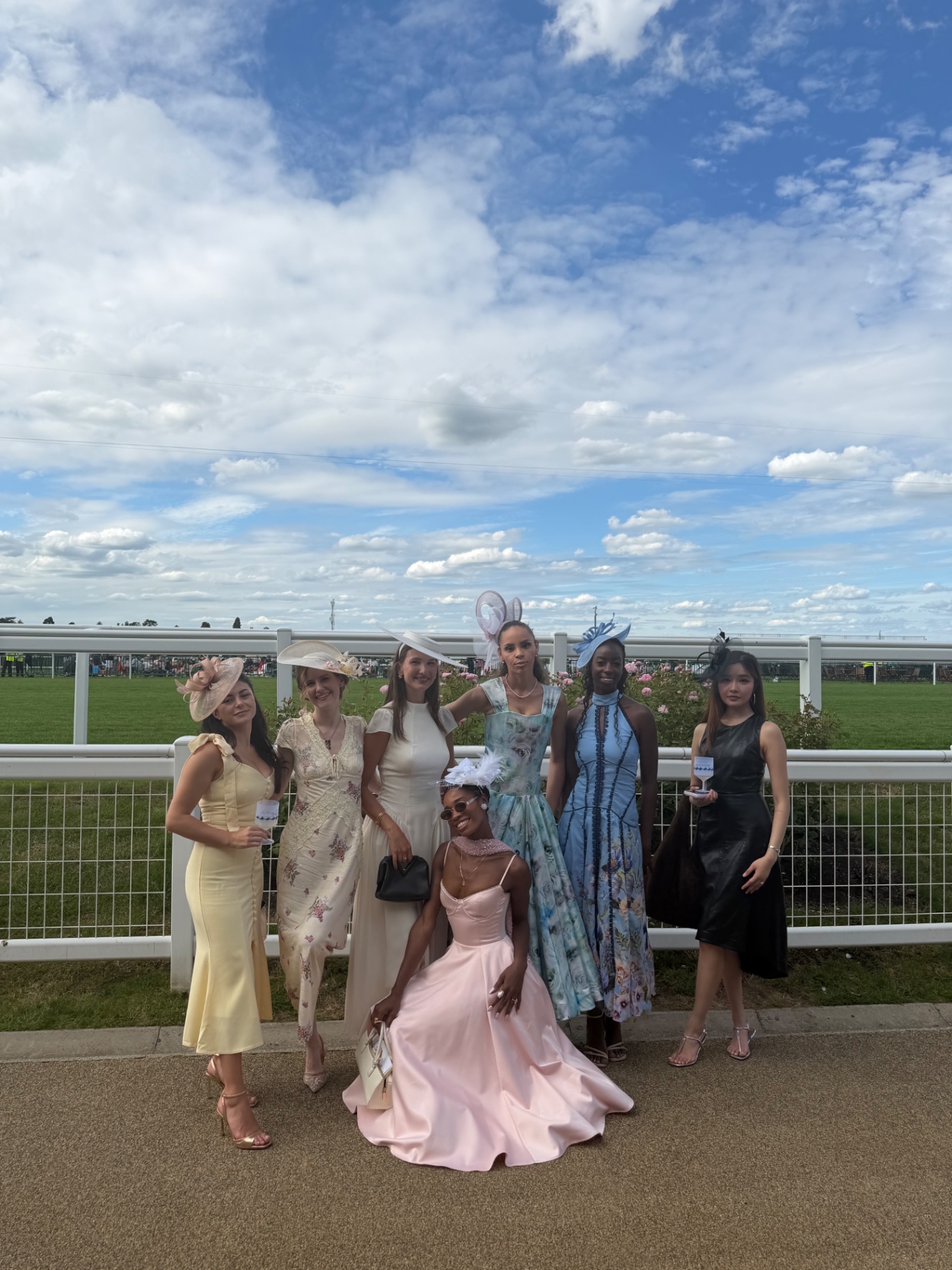 The full group of members posing trackside at Royal Ascot