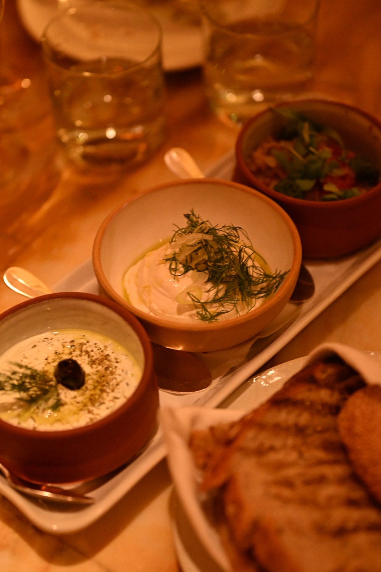 Mezze dips and warm bread shared across the table