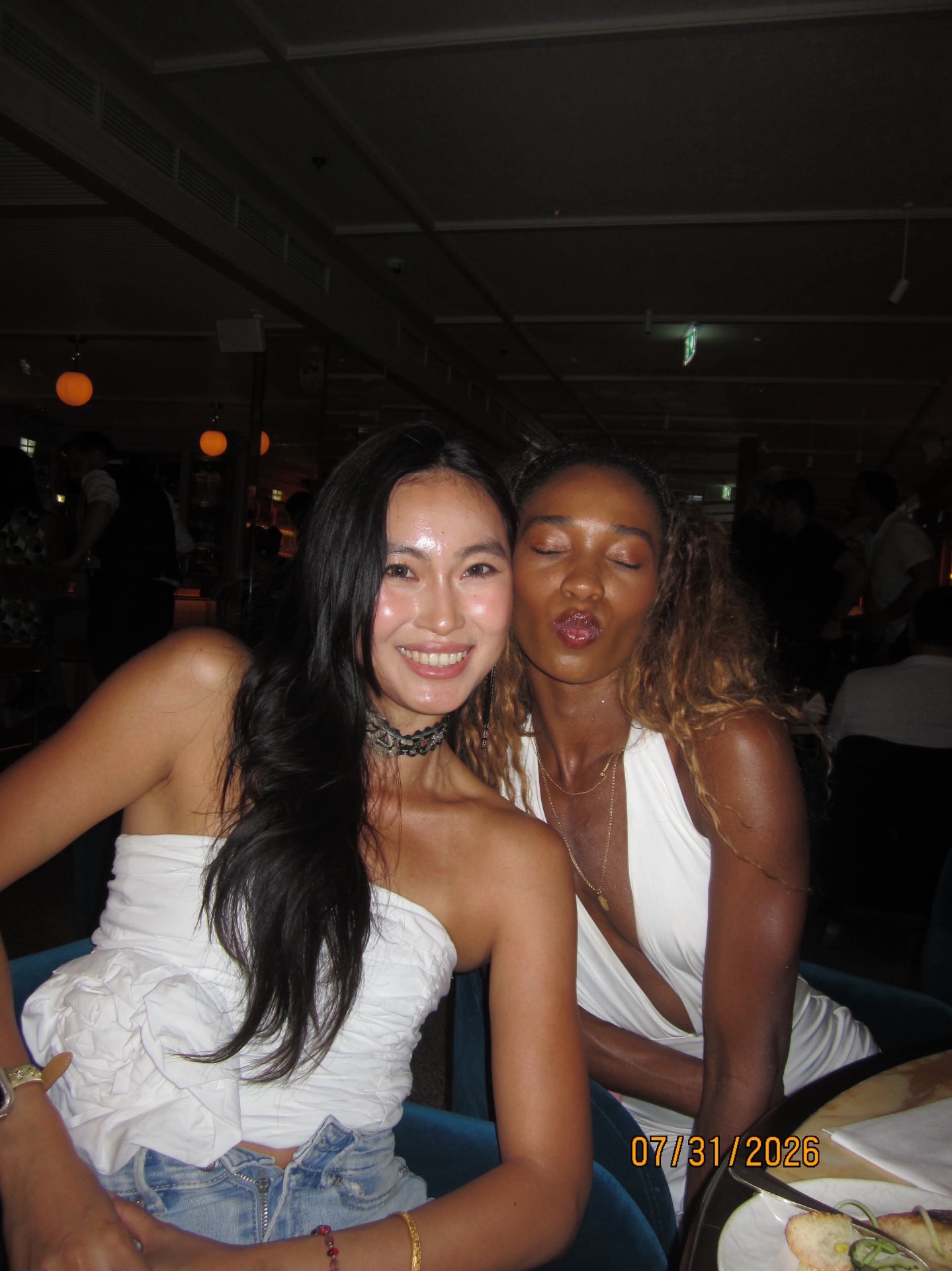 Two members laughing together at the Gaia Mayfair dinner table